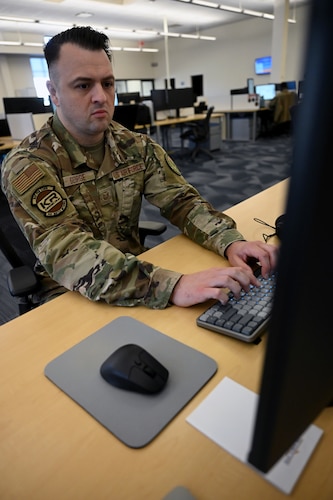 Tech. Sgt. Zackary George works on Kessel Run projects, here, Oct. 21. Kessel Run is part of the Department of the Air Force’s Program Executive Office for Command, Control, Communications and Battle Management. Kessel Run is a division that delivers resilient command and control and targeting software capabilities that provide warfighters with decision advantage. George is a program manager for KR’s Patriot Excalibur. (Official Air Force Photo by Richard Blumenstein)