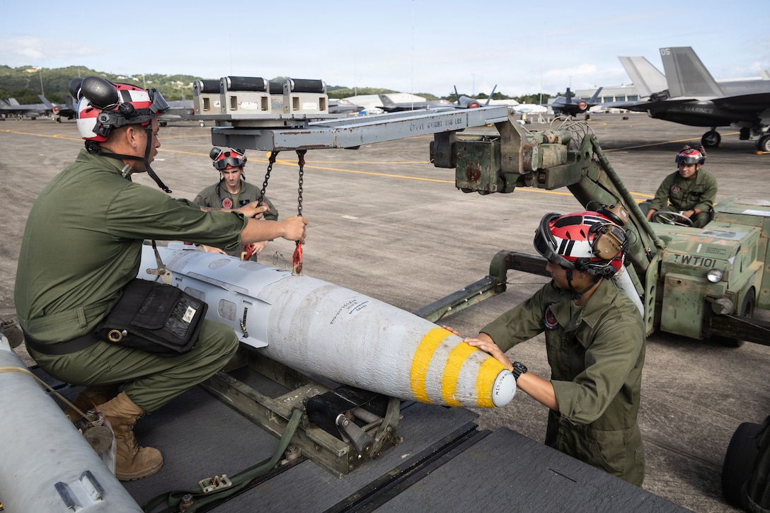 U.S. Marine Corps ordnance technicians with Marine Fighter Attack Squadron (VMFA) 225, U.S. Marine Corps Forces, South, attach a Laser Joint Directed Attack Munition to a Short Airfield for Tactical Support weapons loader at Jose Aponte de la Torre Airport in Ceiba, Puerto Rico, Dec. 22, 2025. U.S. military forces are deployed to the Caribbean in support of the U.S. Southern Command mission, Department of War-directed operations, and the president’s priorities to disrupt illicit drug trafficking and protect the homeland. (U.S. Marine Corps photo)