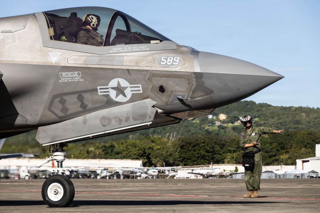 A U.S. Marine Corps plane captain with Marine Fighter Attack Squadron (VMFA) 225, U.S. Marine Corps Forces, South, launches a U.S. Marine Corps F-35B Lightning II assigned to VMFA-225 at Jose Aponte de la Torre Airport in Ceiba, Puerto Rico, Dec. 22, 2025. U.S. military forces are deployed to the Caribbean in support of the U.S. Southern Command mission, Department of War-directed operations, and the president’s priorities to disrupt illicit drug trafficking and protect the homeland. (U.S. Marine Corps photo)