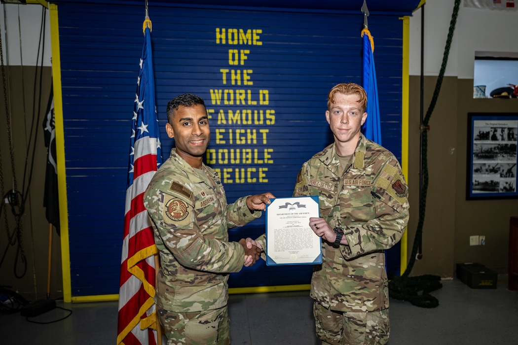 U.S. Air Force Airman 1st Class Ryland Perez-Settle, 822nd Base Defense Squadron poses with 822nd BDS leadership following the presentation of the Air Force Achievement Medal.