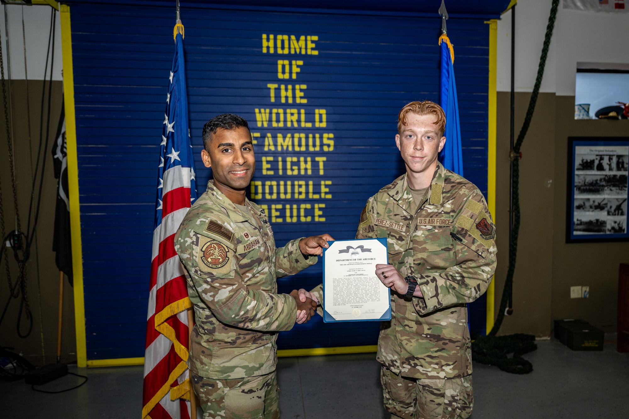 U.S. Air Force Airman 1st Class Ryland Perez-Settle, 822nd Base Defense Squadron poses with 822nd BDS leadership following the presentation of the Air Force Achievement Medal.
