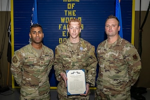U.S. Air Force Airman 1st Class Ryland Perez-Settle, 822nd Base Defense Squadron poses with 822nd BDS leadership following the presentation of the Air Force Achievement Medal.