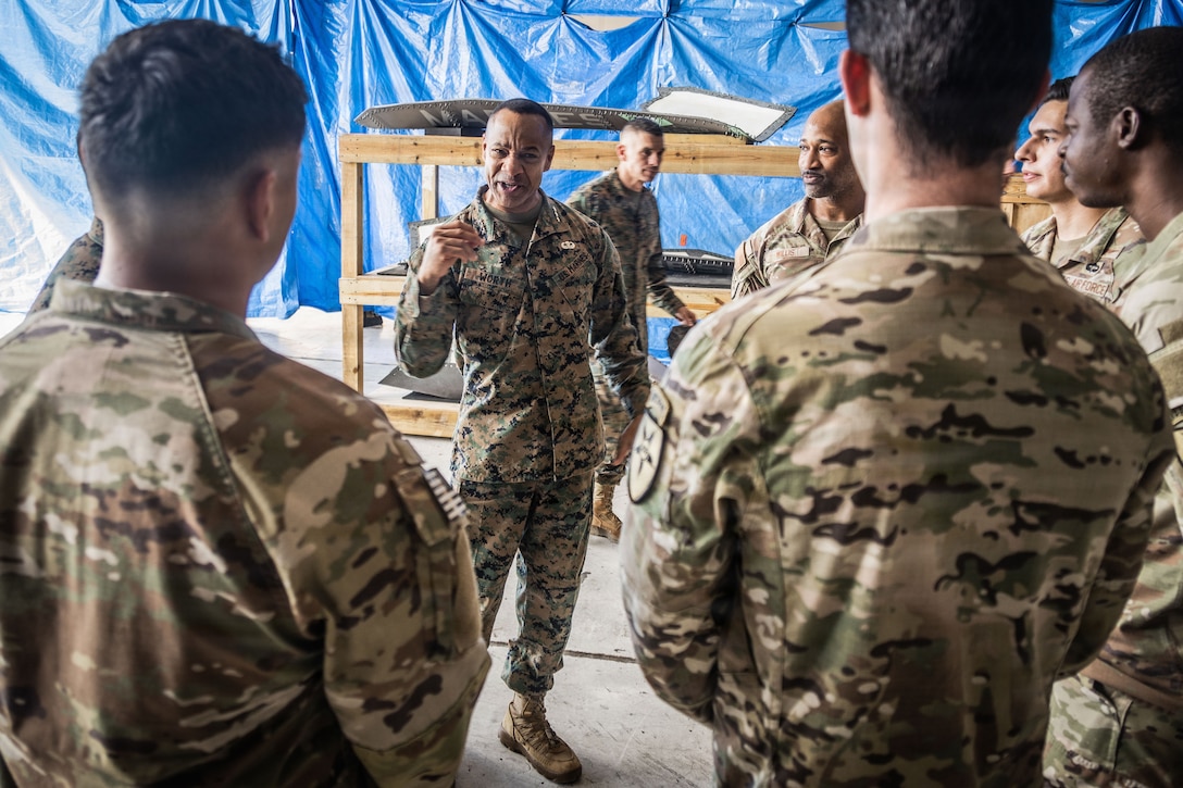 U.S. Marine Corps Lt. Gen. Calvert L. Worth, commanding general, II Marine Expeditionary Force, speaks to U.S. service members with Joint Communications Support Element, U.S. Transportation Command, at Jose Aponte de la Torre Airport in Ceiba, Puerto Rico, Dec. 12, 2025. U.S. military forces are deployed to the Caribbean in support of the U.S. Southern Command mission, Department of War-directed operations, and the president’s priorities to disrupt illicit drug trafficking and protect the homeland. (U.S. Marine Corps photo)