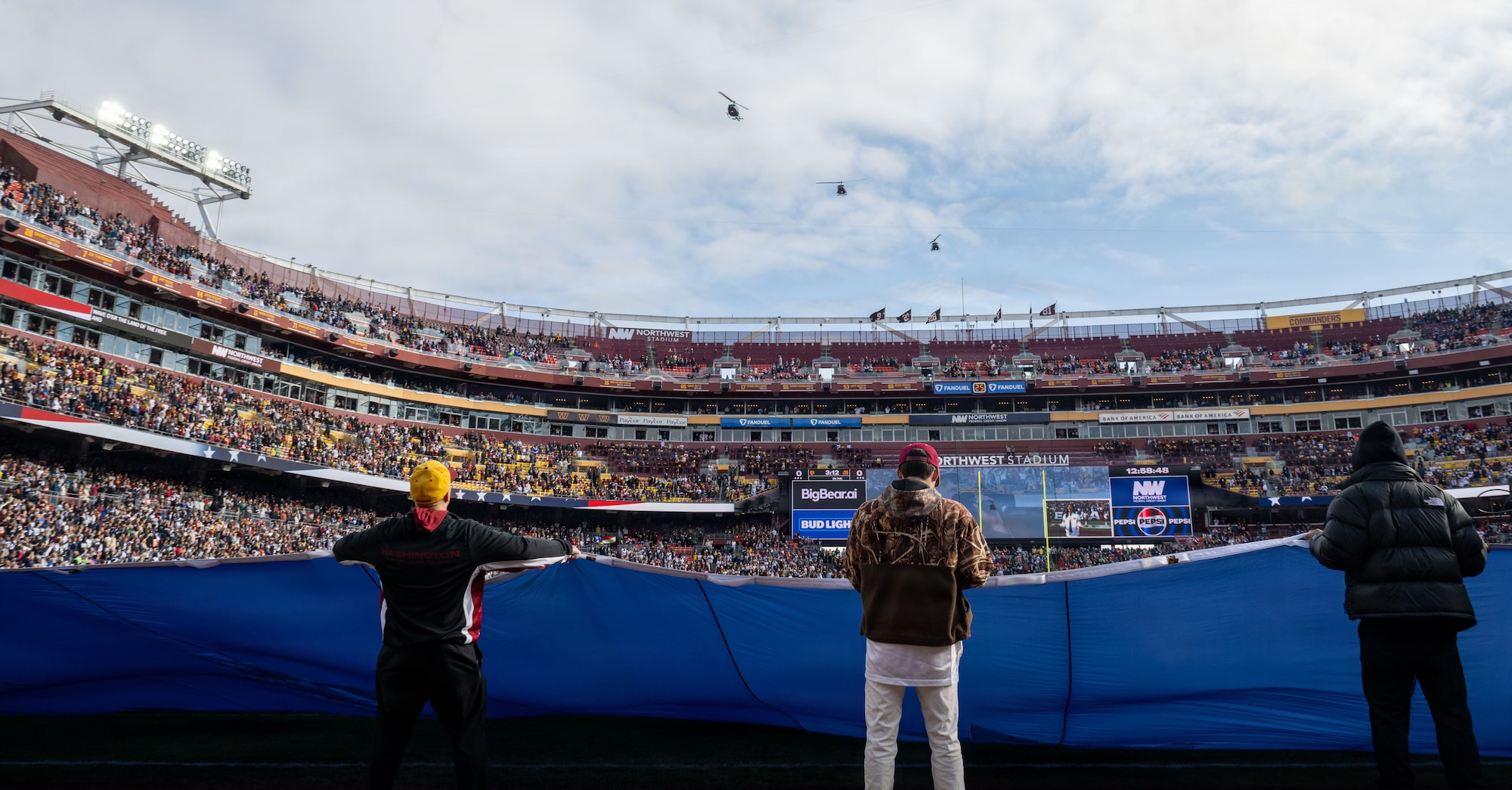 Helicopters fly over stadium