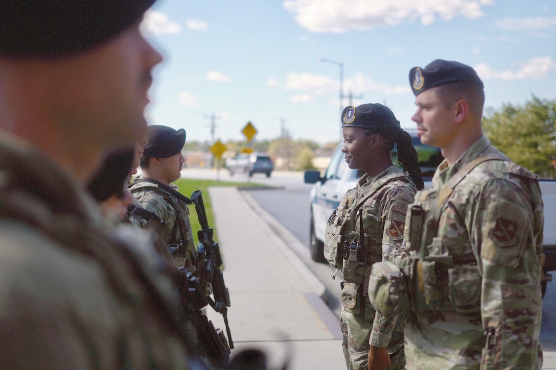 U.S. Air Force 2nd Lt. Bahja J. Jones, 316th Security Forces Squadron Bravo Flight commander, and Tech Sgt. Micah J. Hursh, 316th SFS Bravo Flight sergeant, conduct a post check at Joint Base Andrews, Maryland, Oct. 23, 2025. Jones enlisted in 2009 and served at Andrews first as a public affairs specialist and then a flight attendant before commissioning through Officer Training School in 2024.