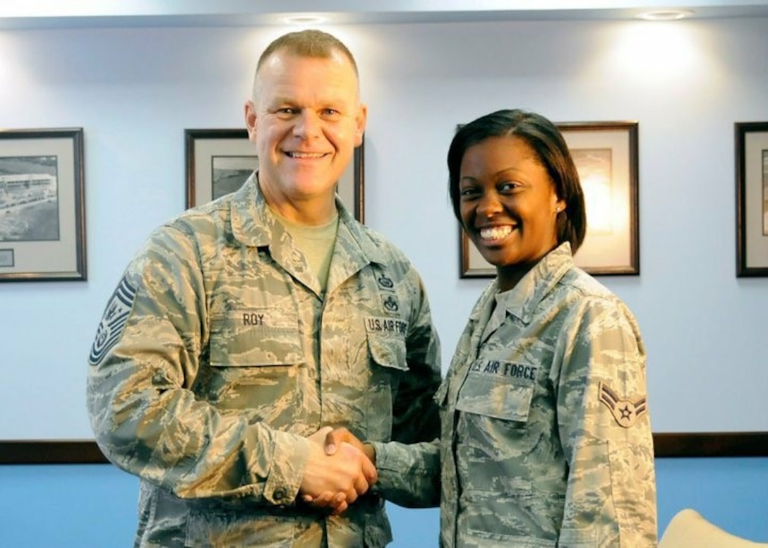 Chief Master Sgt. of the Air Force James A. Roy shakes hands with Airman 1st Class Bahja J. Jones, 11th Wing Public Affairs, after an interview at the Pentagon in Arlington, Virginia, in August 2011. Jones reached the rank of technical sergeant and commissioned as second lieutenant after graduating from Officer Training School on Sept. 27, 2024, and is now a flight commander with the 316th Security Forces Squadron at Joint Base Andrews, Maryland.