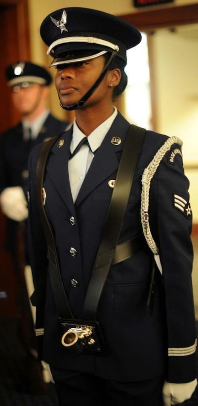 U.S. Air Force Senior Airman Bahja J. Jones, Joint Base Andrews Honor Guard, stands at attention during an event at The Club at Joint Base Andrews, Maryland, in 2012. Jones commissioned as a second lieutenant in 2024 and is now a flight commander with the 316th Security Forces Squadron at Andrews.