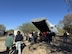 Visitors enter the rear cargo bay of a simulated military transport aircraft during a public engagement event at Joint Base San Antonio–Lackland, Texas, on Jan. 6, 2026.