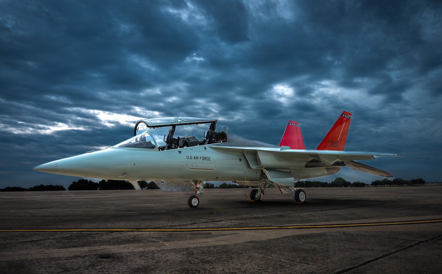 The first T-7A Red Hawk sits parked on the South ramp runway  December 5, 2025 at Joint Base San Antonio-Randolph. The T-7A is the Air Force's newest pilot training aircraft that will close the gap between basic pilot training and fifth generation warfare.