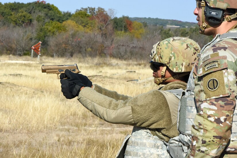 A Soldier assigned to the 2-382nd Logistics Support Battalion, 85th U.S. Army Reserve Support Command, fires her weapon during the Mustangs Challenge conducted at Fort Hood, Texas, on December 14, 2025.