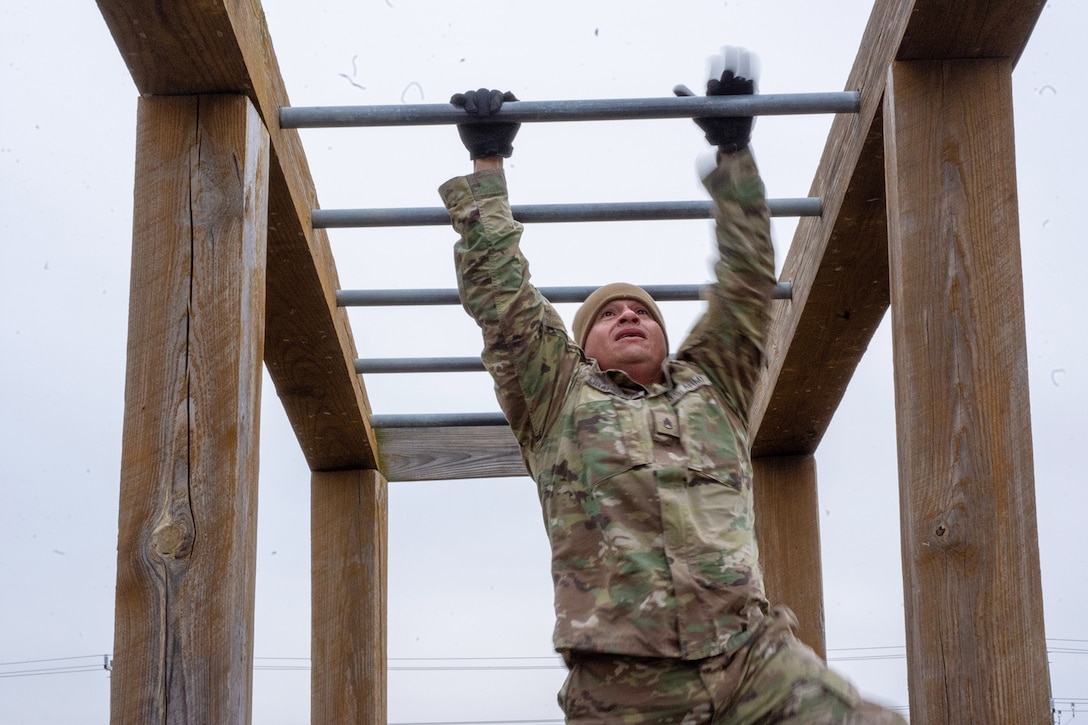 A Soldier assigned to the 2-382nd Logistic Support Battalion, 85th U.S. Army Reserve Support Command, navigates an obstacle course during the Mustangs Challenge readiness training conducted at Fort Hood, Texas, December 14, 2025.