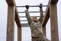 A Soldier assigned to the 2-382nd Logistic Support Battalion, 85th U.S. Army Reserve Support Command, navigates an obstacle course during the Mustangs Challenge readiness training conducted at Fort Hood, Texas, December 14, 2025.