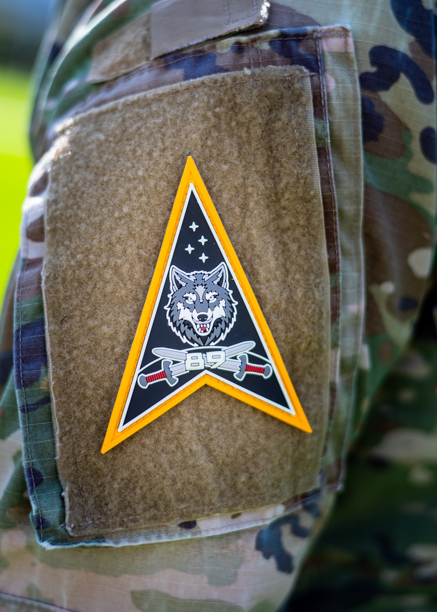 Space Systems Command’s (SSC) System Delta (SYD 89), conducts a patching ceremony at Los Angeles Air Force Base on September 30, 2025. The SYD 89’s wolf motif reflects SYD 89’s commitment to teamwork, aggressive offense, and unwavering protection of allies in the face of adversarial threats. The wolf is a formidable hunter individually, but in a pack, they’re relentlessly combat effective. SYD 89 develops and delivers cyber, ground- and space-based combat power capabilities to contest and control the space domain through fires, movement, and maneuver, preserving U.S., Allied, and commercial freedom of action in, from, and to space. SYD 89 supports the Space Combat Power (SCP) Program Executive Office (PEO). (U.S. Space Force photo by Van Ha)