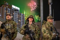 U.S. Army Spc. Ulises Enriquez (left), Sgt. Andrea Flenner (center), Spc. Xarn Manzon (right) conducts security operations on the Las Vegas 'Strip' in Las Vegas, Nevada, Jan. 1, 2026.  For more than 25 years, the Nevada National Guard has supported New Year's Eve public safety operations, with roughly 190 Soldiers activated for this year's event. (U.S. Army National Guard photo by 1st Lt. Byronjames Crisostomo)