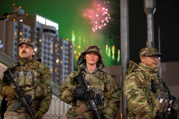 U.S. Army Spc. Ulises Enriquez (left), Sgt. Andrea Flenner (center), Spc. Xarn Manzon (right) conducts security operations on the Las Vegas 'Strip' in Las Vegas, Nevada, Jan. 1, 2026.  For more than 25 years, the Nevada National Guard has supported New Year's Eve public safety operations, with roughly 190 Soldiers activated for this year's event. (U.S. Army National Guard photo by 1st Lt. Byronjames Crisostomo)