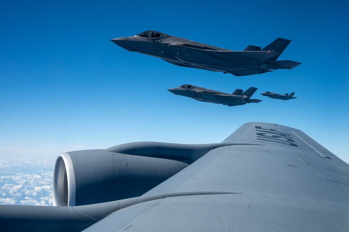 Three U.S. Air Force F-35A Lightning IIs assigned to the 356th Expeditionary Fighter Squadron, deployed to Kadena Air Base, fly in formation before aerial refueling over the Pacific Ocean, Dec. 11, 2025