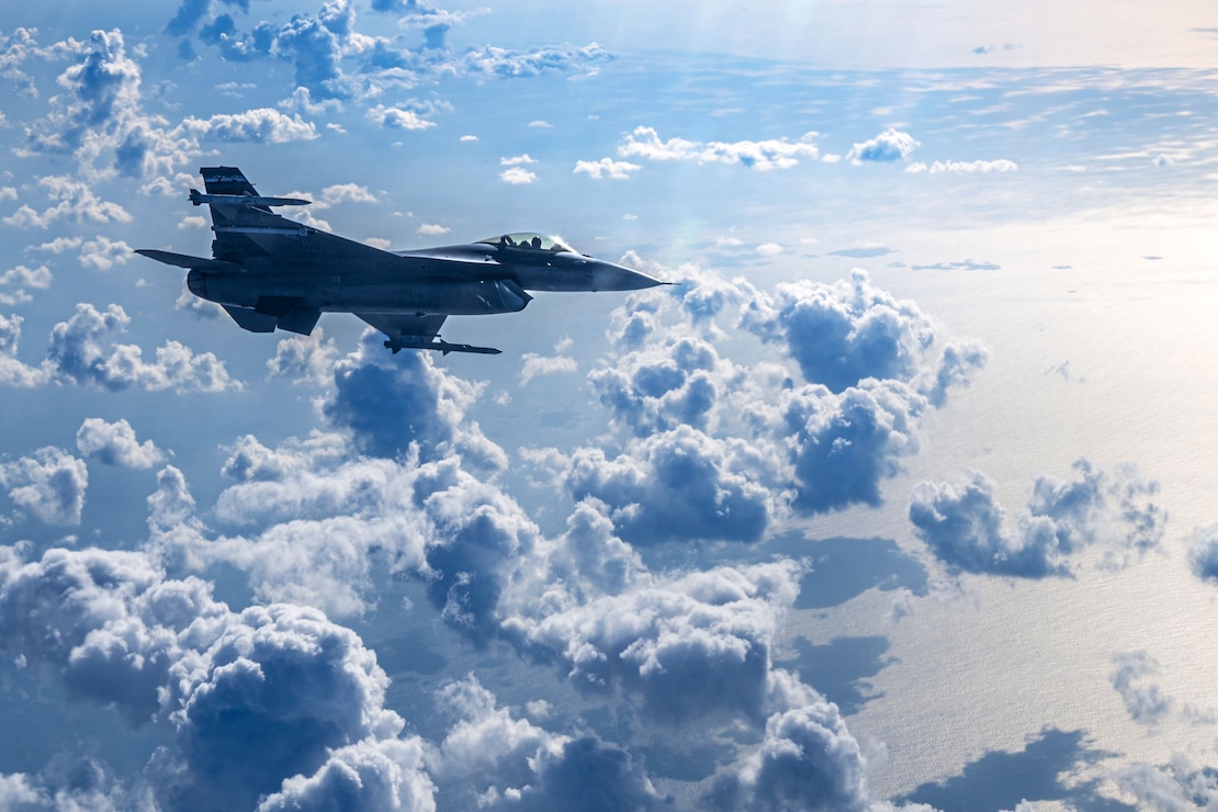 A U.S. Air Force F-16C Fighting Falcon assigned to the 119th Expeditionary Fighter Squadron, deployed to Kadena Air Base, flies over the Pacific Ocean, Japan, Dec. 18, 2025.