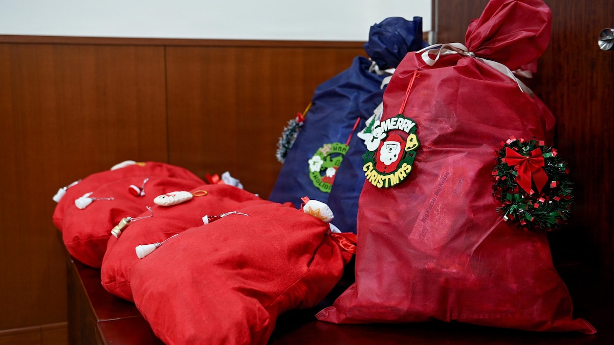 Christmas bags of goodies wait to be handed to Misawa Cookie Caper volunteers by Japan Air Self-Defense Force members at Misawa Air Base, Japan, Dec. 15, 2025. The gesture marked a continuation of a cross-cultural exchange that began with volunteers delivering cookies to JASDF Airmen, reinforcing the partnerships and morale that help strengthen the bonds between the bilateral partners. (U.S. Air Force photo by Airman 1st Class Hannah Bench)