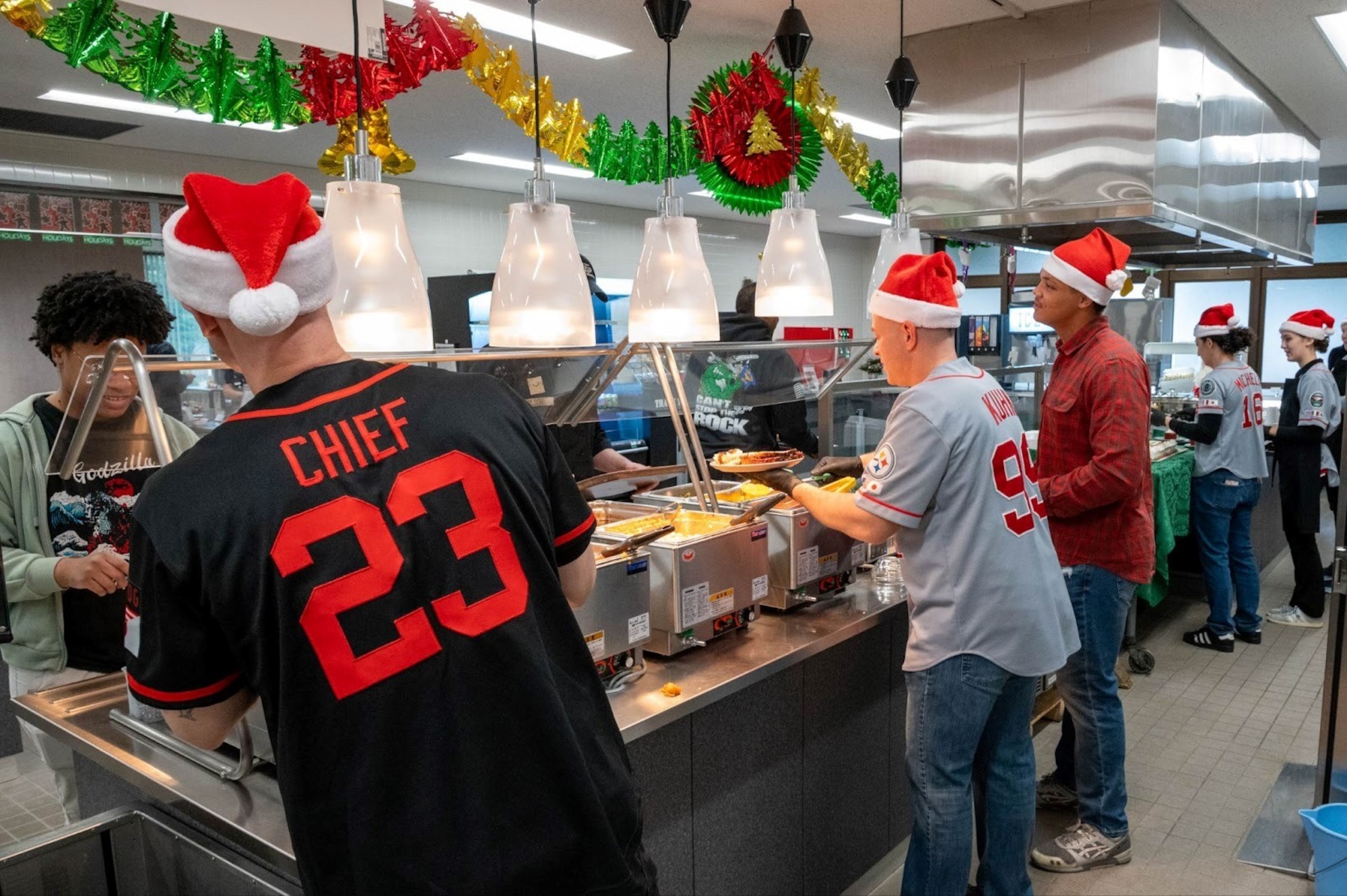 U.S. Air Force 35th Fighter Wing (FW) group commanders and volunteers serve service members during the 2025 Grissom Dining Facility Christmas Lunch at Misawa Air Base, Japan, Dec. 25, 2025.