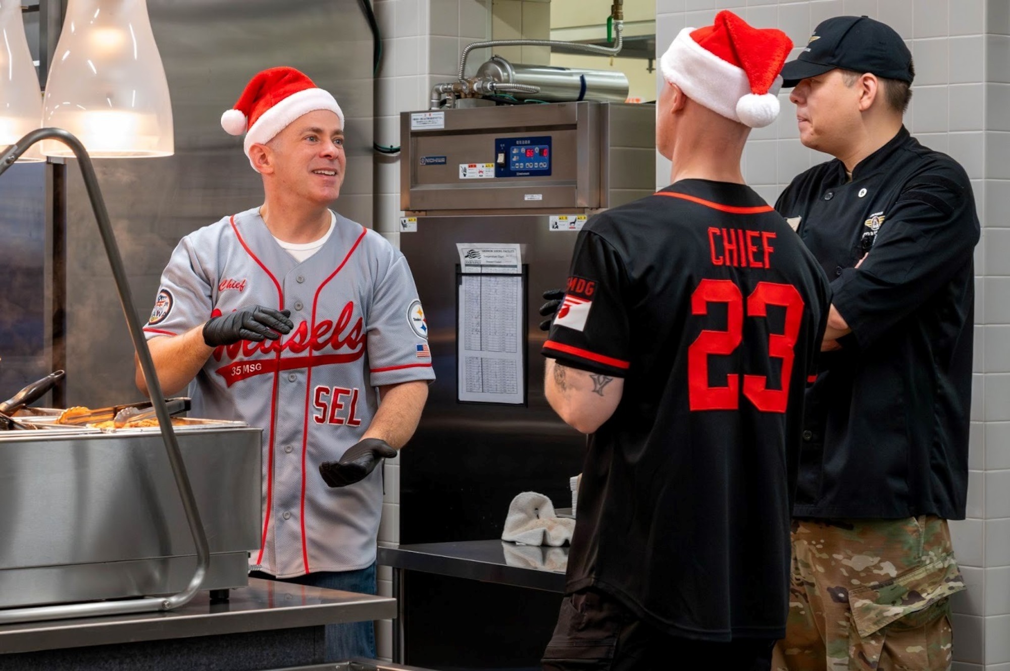 U.S. Air Force 35th Fighter Wing (FW) group commanders speak with one another during the 2025 Grissom Dining Facility Christmas Lunch at Misawa Air Base, Japan, Dec. 25, 2025.