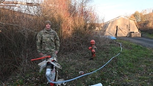 Staff Sgt. Colton Walls, 1st Combat Communications Squadron electrical power production supervisor, used his prior skills and initiative to solve a problem that enabled 180 Airmen to have showers during Exercise Heavy Rain 25, in Grostenquin, France. His efforts were noticed and he was coined by the 435th Air Ground Operations Wing commander and safety office. (U.S. Air Force photo by Capt. Lou Burton)