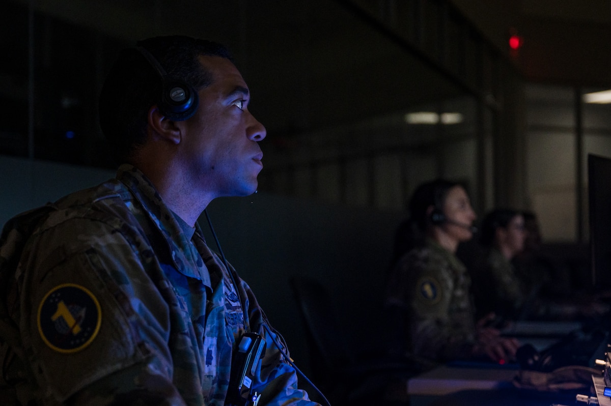 Image of a Guardian looking at a monitor.