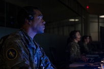 Image of a Guardian looking at a monitor.