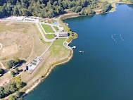 The U.S. Naval Research Laboratory (NRL) launched a groundbreaking remote sensing experiment, Coastal Hyperspectral Reflectance Object Material Analysis (CHROMA), Sept. 4-19, 2025, designed to accelerate the application of artificial intelligence (AI) in hyperspectral imaging and strengthen environmental intelligence and resource management capabilities across the Department of War and the wider scientific community. A bird's-eye view from an RIT drone shows the Rochester Institute of Technology’s Open Community eXperiment (ROCX) experiment site.  The rock sample arrays are visible on land (left-middle portion of the photo), while the coated panels float on the water (upper-right), allowing for simultaneous data collection in a real aquatic-land environment. The photo also shows various other targets belonging to industry and academic participants in the ROCX. (Photo by Timothy Bauch and Nina Raqueno, Rochester Institute of Technology)