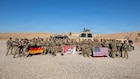 U.S. and German Soldiers pose for a group photo following completion of the Schützenschnur qualification at Beneswala Range on Oct. 31, 2025. The multinational event fostered camaraderie, interoperability, and shared standards between partner forces deployed to the region. (U.S. Army photo by Spc. Doniel Kennedy.)