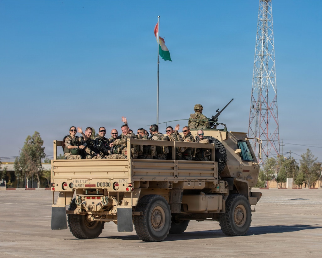 German Soldiers load into an LMTV for transportation to the Schützenschnur qualification at Beneswala Range on Oct. 31, 2025. The movement supported seamless integration for partnered forces participating in the joint marksmanship event. (U.S. Army photo by Spc. Doniel Kennedy.)