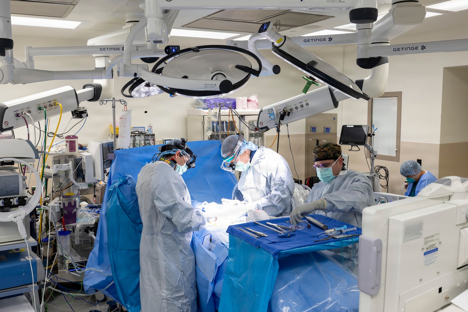 U.S. Navy Capt. (Dr.) Michael Cirivello, chief of Neurosurgery at Walter Reed National Military Medical Center, and his team perform a spinal fusion to alleviate a patient’s chronic back pain