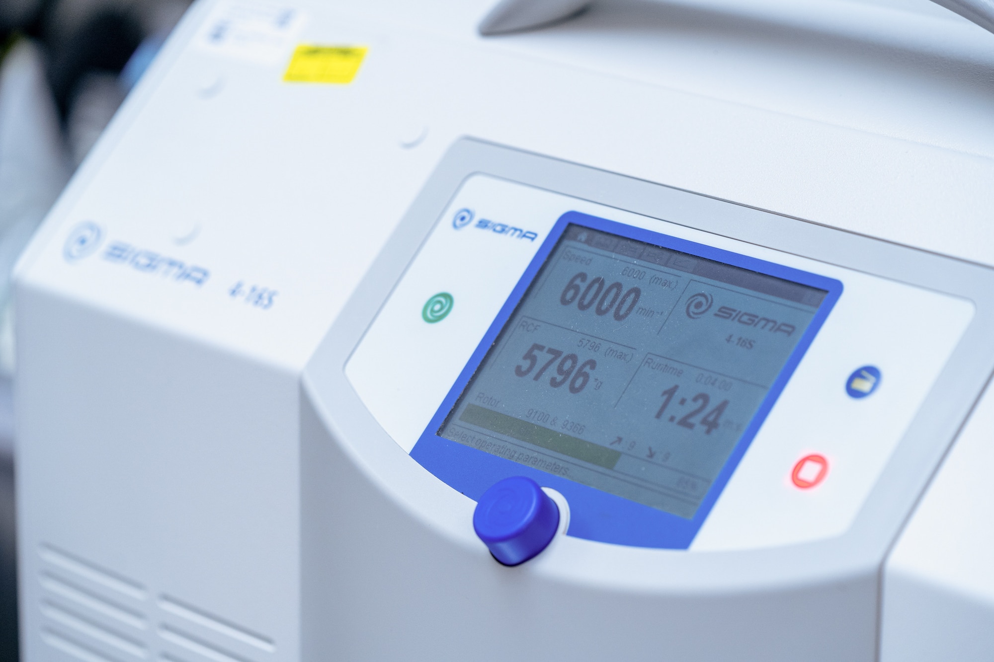 A white machine with a display screen surrounded by a blue border.