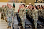 Soldiers with Oklahoma Army National Guard’s 745th Military Police Detachment, 345th Combat Sustainment Support Battalion, 90th Troop Command file into their seats during a farewell ceremony held for them at the Armed Forces Reserve Center in Mustang, Oklahoma, Oct. 21, 2025. Friends, family and Oklahoma National Guard leaders gathered to see the nearly 50 Soldiers as they deploy to the Middle East in support of Operation Spartan Shield, a U.S. military operation in U.S. Central Command’s area of operations aimed at building partner capacity and enhancing security in the Middle East. (Oklahoma National Guard photo by Sgt. Haden Tolbert)