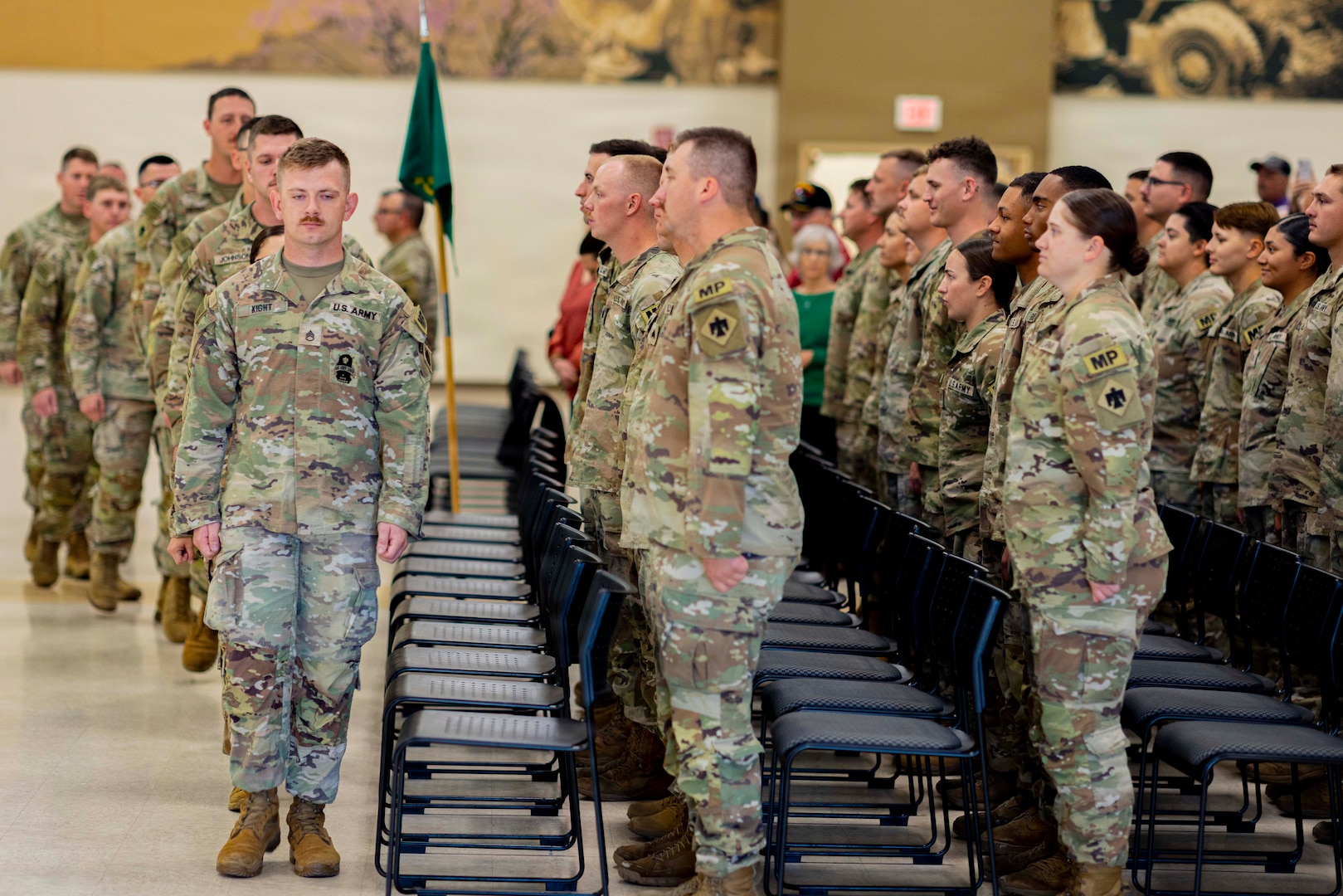 Soldiers with Oklahoma Army National Guard’s 745th Military Police Detachment, 345th Combat Sustainment Support Battalion, 90th Troop Command file into their seats during a farewell ceremony held for them at the Armed Forces Reserve Center in Mustang, Oklahoma, Oct. 21, 2025. Friends, family and Oklahoma National Guard leaders gathered to see the nearly 50 Soldiers as they deploy to the Middle East in support of Operation Spartan Shield, a U.S. military operation in U.S. Central Command’s area of operations aimed at building partner capacity and enhancing security in the Middle East. (Oklahoma National Guard photo by Sgt. Haden Tolbert)