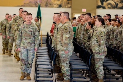 Soldiers with Oklahoma Army National Guard’s 745th Military Police Detachment, 345th Combat Sustainment Support Battalion, 90th Troop Command file into their seats during a farewell ceremony held for them at the Armed Forces Reserve Center in Mustang, Oklahoma, Oct. 21, 2025. Friends, family and Oklahoma National Guard leaders gathered to see the nearly 50 Soldiers as they deploy to the Middle East in support of Operation Spartan Shield, a U.S. military operation in U.S. Central Command’s area of operations aimed at building partner capacity and enhancing security in the Middle East. (Oklahoma National Guard photo by Sgt. Haden Tolbert)