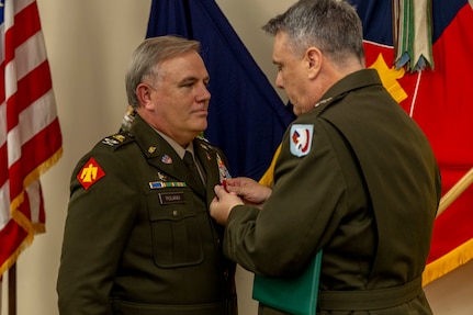 Col. Kevin Roland receives the Legion of Merit from Maj. Gen. Thomas H. Mancino, adjutant general for Oklahoma, during his retirement ceremony at the Oklahoma City Military Complex in Oklahoma City, Oct. 30, 2025. Roland served 34 years in the military, starting in the Marine Corps before joining the Oklahoma Army National Guard, where he served in numerous impactful roles. Though retired from military service, Roland will continue to serve in a civilian role as the State Youth Programs Director, where he will oversee Thunderbird Challenge Program, Sooner Job Challenge and STARBASE Oklahoma. (Oklahoma National Guard Photo by Sgt. Haden Tolbert)