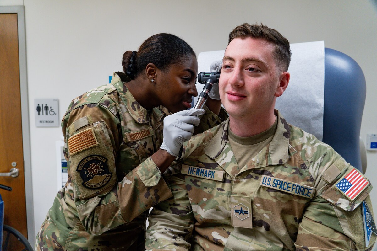 Image of an Airman treating a Guardian.