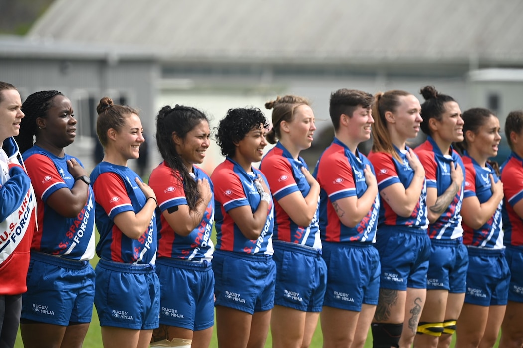 Space Force Rugby players stand for the pledge of allegiance