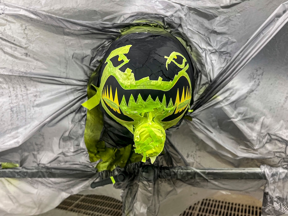 An A-10C Thunderbolt II model is masked and ready to be painted at Moody Air Force Base, Georgia, Sept. 30, 2025. Using a mix of fabrication and painting methods, Airmen refreshed the model to highlight the 23d Wing’s history and mission. (U.S. Air Force photo by Tech. Sgt. Christopher Buentello)