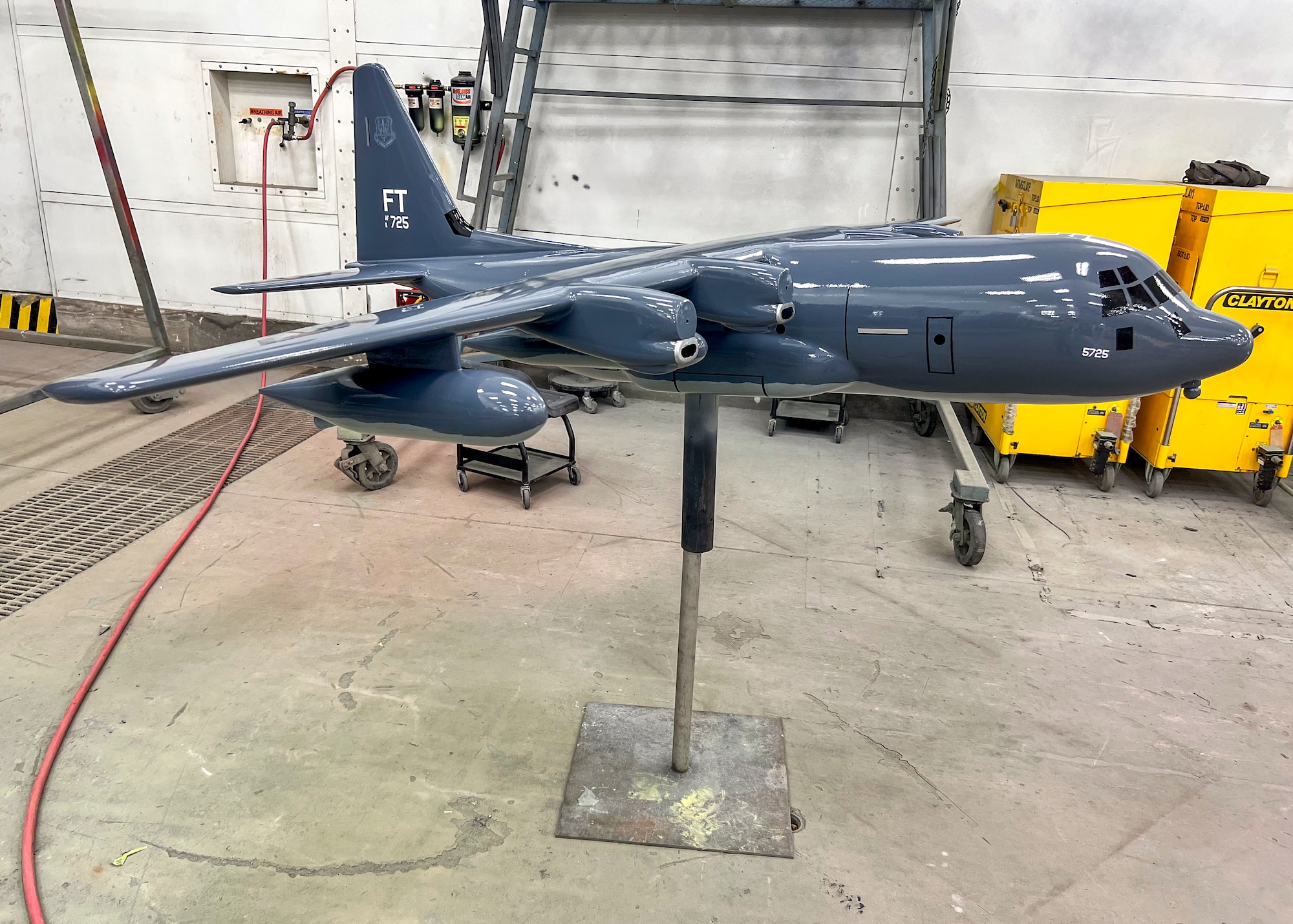 An HC-130J Combat King II model dries after a clearcoat application at Moody Air Force Base, Georgia, Oct. 29, 2025. The clearcoat was applied to protect the model and help preserve Moody’s miniature aircraft displays for future visitors. (U.S. Air Force photo by Tech. Sgt. Christopher Buentello)