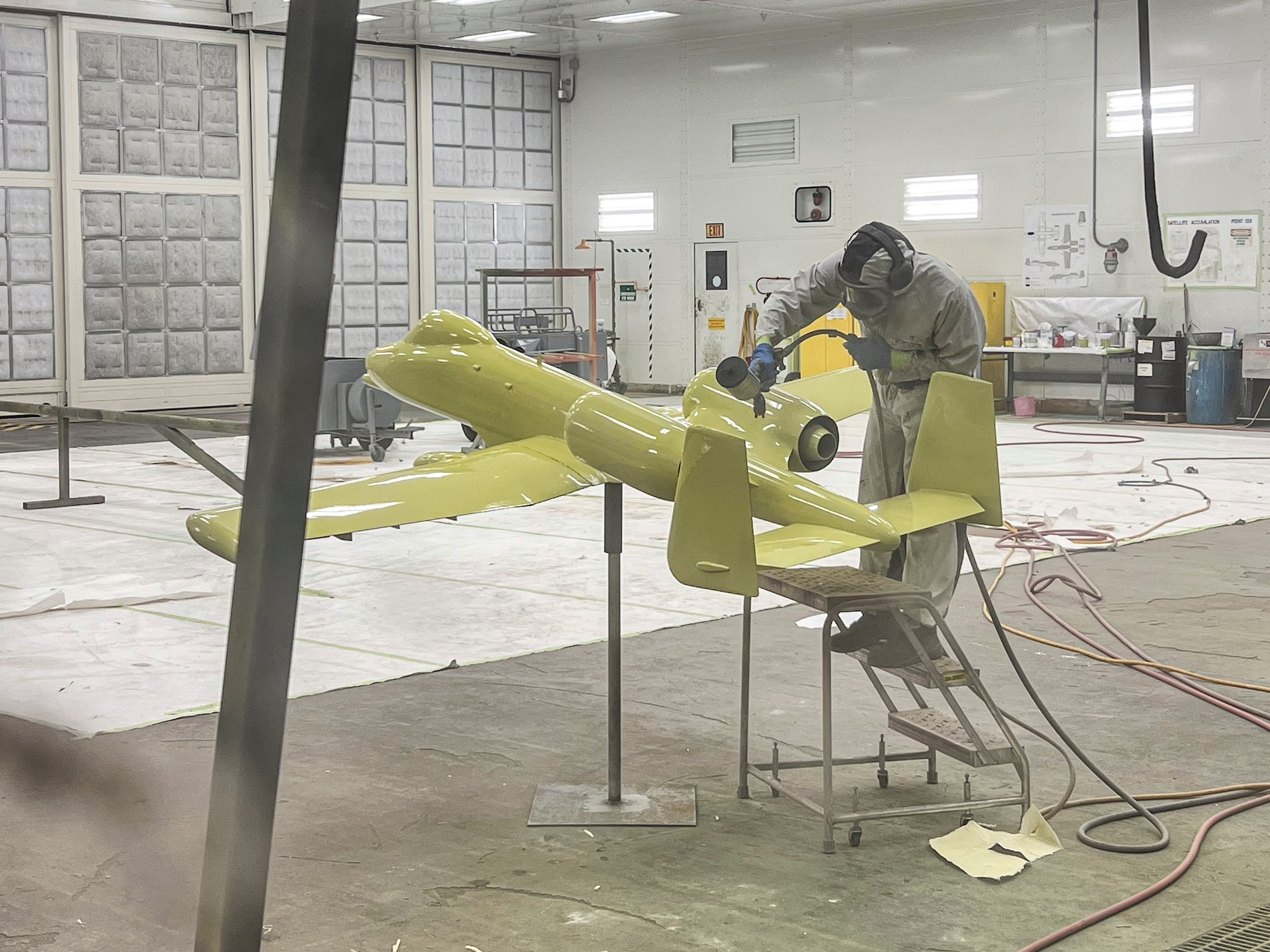 U.S. Air Force Airman 1st Class Zach Langdon, 23d Maintenance Squadron aircraft structural maintenance specialist, applies chromated primer to an A-10C Thunderbolt II model at Moody Air Force Base, Georgia, Aug. 28, 2025. Airmen repaired and repainted the model, restoring it to represent the 23d Wing’s heritage while protecting it from future weather damage. (U.S. Air Force photo by Tech. Sgt. Christopher Buentello)