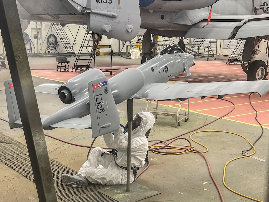 U.S. Air Force Senior Airman Tyson Eglinton, 23d Maintenance Squadron aircraft structural maintenance specialist, applies clearcoat to an A-10C Thunderbolt II model at Moody Air Force Base, Georgia, Oct. 2, 2025. The clearcoat helps protect the model from sun and weather damage while giving it a polished, finished look. (U.S. Air Force photo by Tech. Sgt. Christopher Buentello)