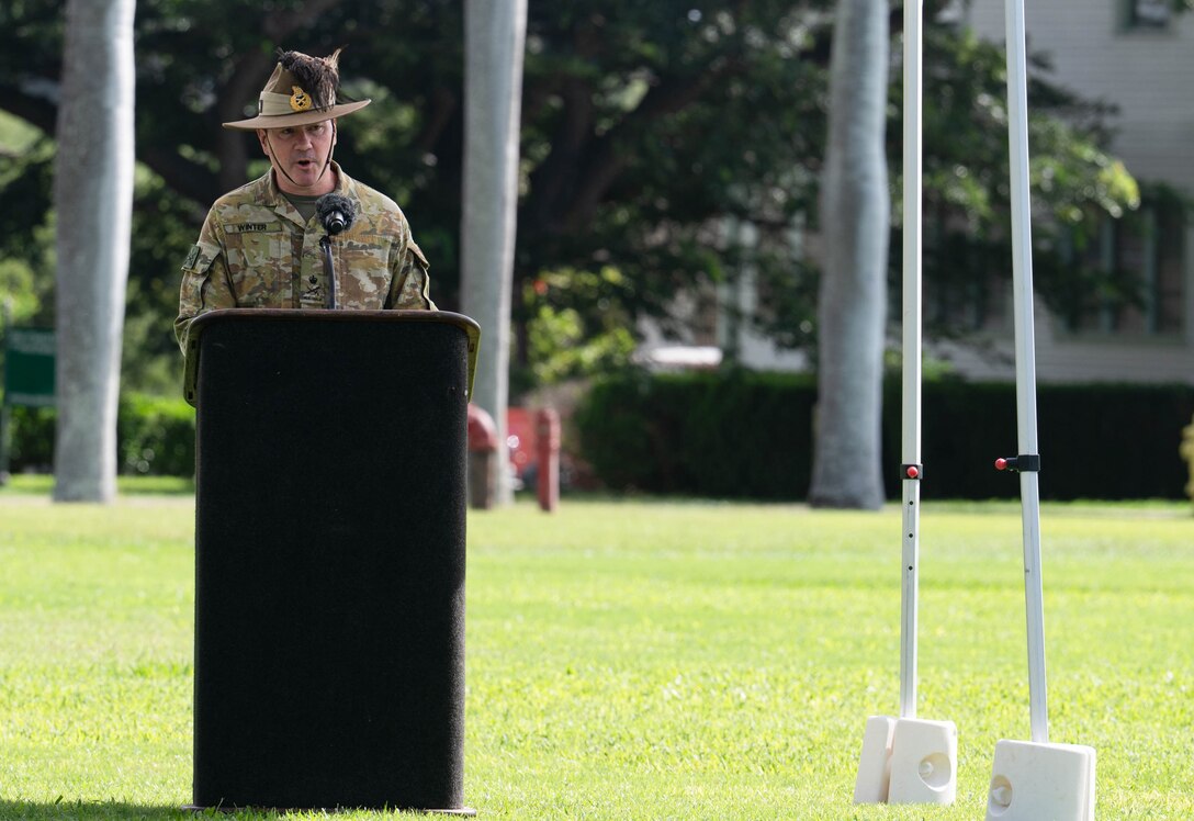 Australian Army Lt. Gen. Scott A. Winter, outgoing deputy commanding general for strategy and plans, U.S. Army Pacific, delivers remarks during a Flying V ceremony at historic Palm Circle, Fort Shafter, Hawaii, Jan. 6, 2026.