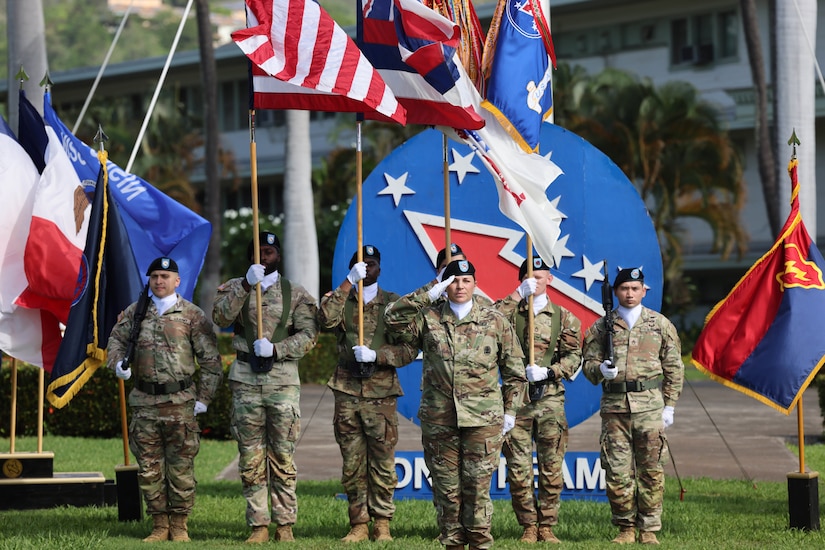 Members of the U.S. Army Pacific color guard present the U.S. and Australian national colors, the Hawaii state flag, and U.S. Army service flags during a Flying V ceremony at historic Palm Circle, Fort Shafter, Hawaii, Jan. 6, 2025.