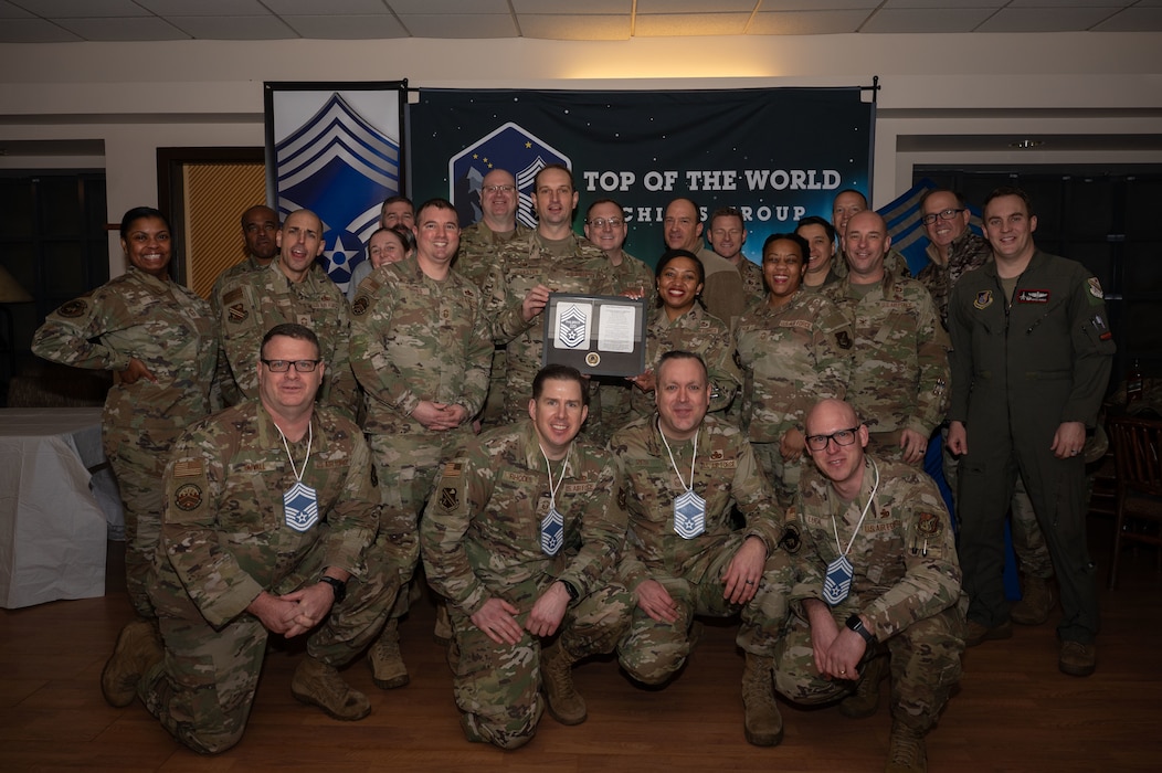 Leadership of the 354th Fighter Wing pose for a photo with the newest chief master sergeant selects at Eielson Air Force Base, Alaska, Jan. 6, 2026.