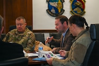 Adam Dontz, center, Deputy Assistant Secretary of War for Housing, meets with the U.S. Air Force’s 11th Wing and Joint Base Anacostia-Bolling leadership regarding the on-base dormitories at JBAB, Washington, D.C., Dec. 9, 2025. Leadership discussed JBAB dormitory conditions and plans to improve the living spaces for JBAB’s junior enlisted members.  (U.S. Air Force photo by Airman 1st Class Shanel Toussaint)