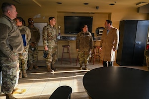 Members of the 11th Wing commander’s action group conduct a tour with Adam Dontz, right, Deputy Assistant Secretary of War for Housing, at the Furnari Hall unaccompanied service member housing facility on Joint Base Anacostia-Bolling, Washington, D.C., Dec. 9, 2025. The group met to tour existing housing facilities and discuss housing improvement projects for JBAB. (U.S. Air force photo by Airman 1st Class Shanel Toussaint)