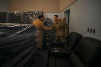 Adam Dontz, Deputy Assistant Secretary of War for Housing, left, greets U.S. Air Force Lt. Col. Daniel Romero, right, commander of the 11th Civil Engineer Squadron during a dormitory tour on Joint Base Anacostia-Bolling, Washington, D.C., Dec. 9, 2025. The group met to tour existing housing facilities and discuss housing improvement projects for JBAB. (U.S. Air force photo by Airman 1st Class Shanel Toussaint)