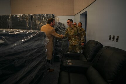 Adam Dontz, Deputy Assistant Secretary of War for Housing, left, greets U.S. Air Force Lt. Col. Daniel Romero, right, commander of the 11th Civil Engineer Squadron during a dormitory tour on Joint Base Anacostia-Bolling, Washington, D.C., Dec. 9, 2025. The group met to tour existing housing facilities and discuss housing improvement projects for JBAB. (U.S. Air force photo by Airman 1st Class Shanel Toussaint)