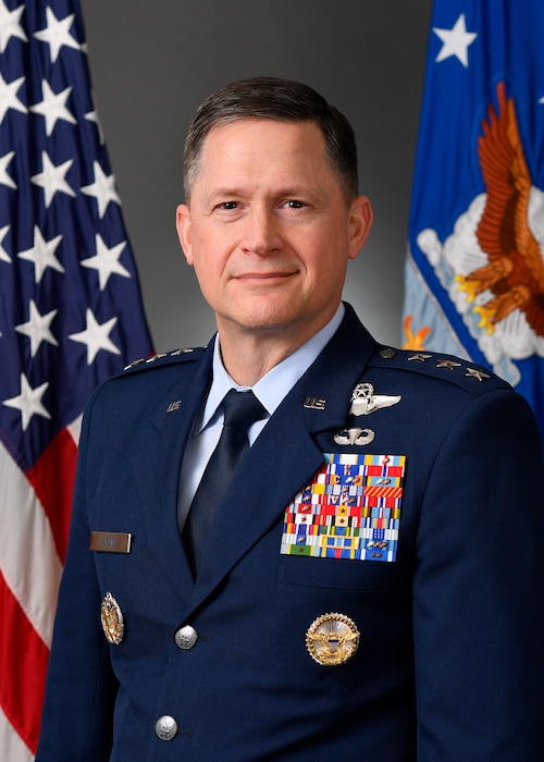 A military member stands for a portrait.